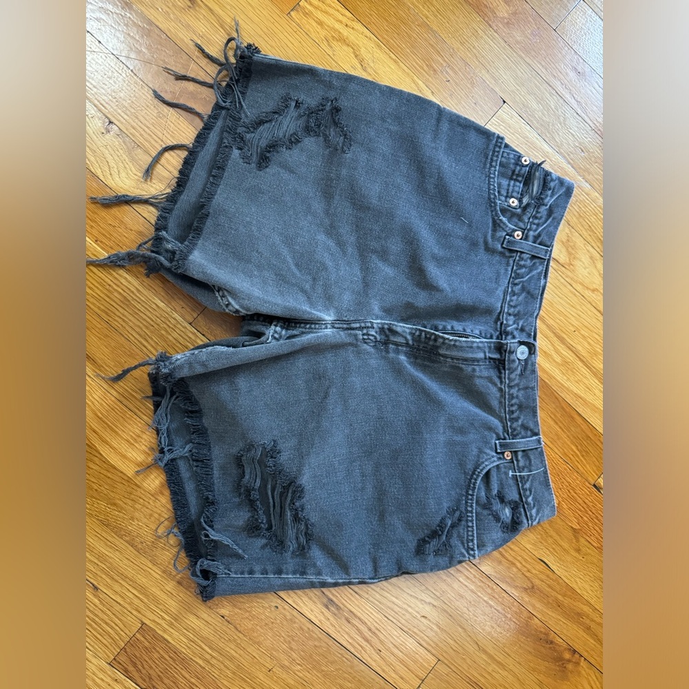 Levi’s distressed black shorts.